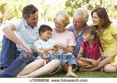 Extended Group Portrait Of Family Enjoying Day In Park View Large Photo Image Stock Photograph - Extended Group Portrait Of Family Enjoying Day In Park. Fotosearch