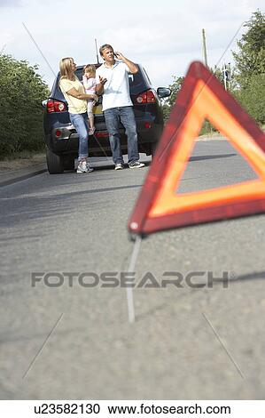 Family Broken Down On Country Road With Hazard Warning Sign In Foreground View Large Photo Image Stock Image - Family Broken Down On Country Road With Hazard Warning Sign In Foreground. Fotosearch