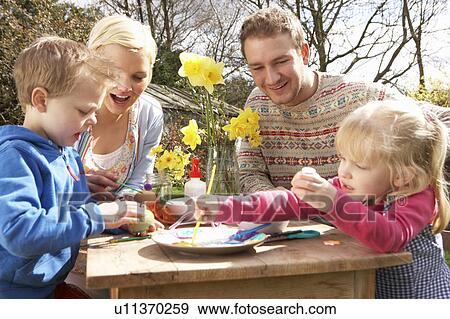 Family Decorating Easter Eggs On Table Outdoors View Large Photo Image Stock Photo - Family Decorating Easter Eggs On Table Outdoors . Fotosearch
