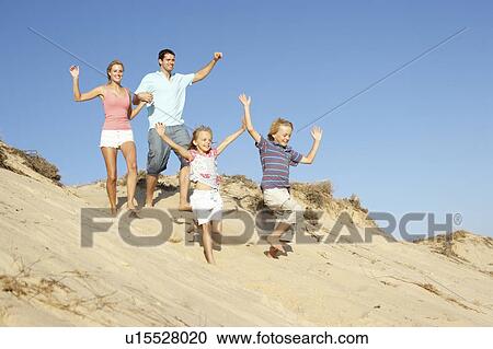 Family Enjoying Beach Holiday Running Down Dune View Large Photo Image Stock Image - Family Enjoying Beach Holiday Running Down Dune. Fotosearch