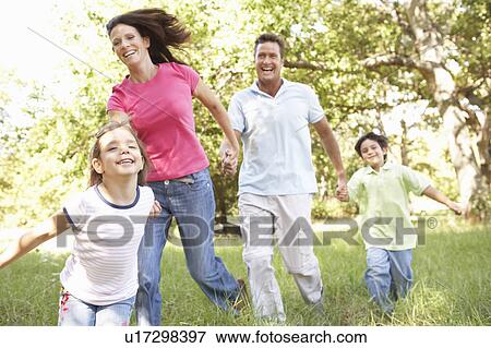 Family Enjoying Walk In Park View Large Photo Image Stock Photo - Family Enjoying Walk In Park. Fotosearch