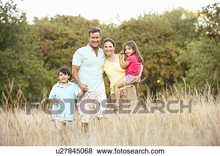 Family Enjoying Walk In Park View Large Photo Image Stock Photo - Family Enjoying Walk In Park. Fotosearch