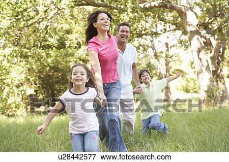 Family Enjoying Walk In Park View Large Photo Image Stock Photo - Family Enjoying Walk In Park. Fotosearch