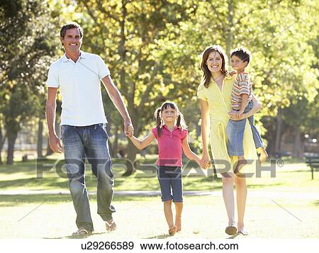 Family Enjoying Walk In Park View Large Photo Image Stock Photo - Family Enjoying Walk In Park. Fotosearch