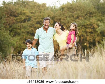 Family Enjoying Walk In Park View Large Photo Image Stock Photograph - Family Enjoying Walk In Park. Fotosearch