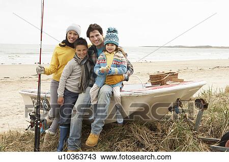 Family Group Sitting On Boat With Fishing Rod On Winter Beach View Large Photo Image Stock Image - Family Group Sitting On Boat With Fishing Rod On Winter Beach. Fotosearch