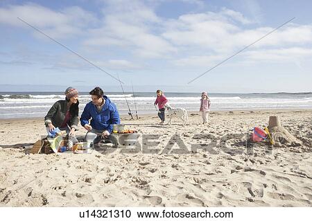 Family Having Barbeque On Winter Beach View Large Photo Image Stock Image - Family Having Barbeque On Winter Beach. Fotosearch