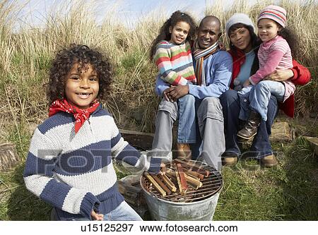 Family Having Barbeque On Winter Beach View Large Photo Image Stock Photo - Family Having Barbeque On Winter Beach. Fotosearch