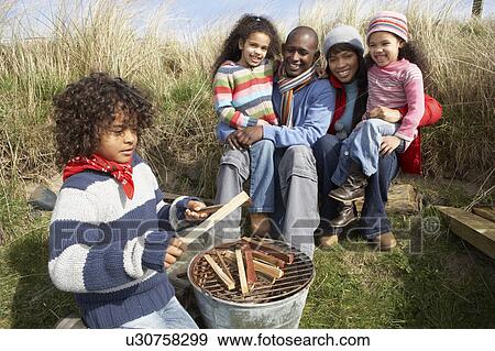 Family Having Barbeque On Winter Beach View Large Photo Image Stock Photo - Family Having Barbeque On Winter Beach. Fotosearch