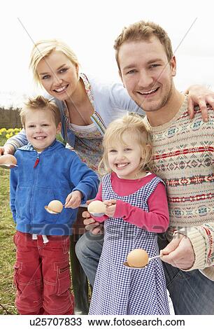 Stock Image - Family Having Egg And Spoon Race. Fotosearch