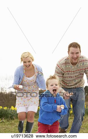Stock Photo - Family Having Egg And Spoon Race. Fotosearch