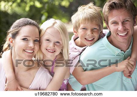 Stock Image - Family Having Fun In Countryside Together. Fotosearch