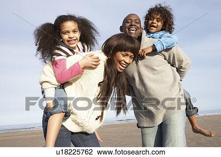 Family Having Fun On Winter Beach View Large Photo Image Stock Image - Family Having Fun On Winter Beach. Fotosearch