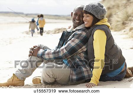 Stock Photo - Family Having Fun On Winter Beach. Fotosearch
