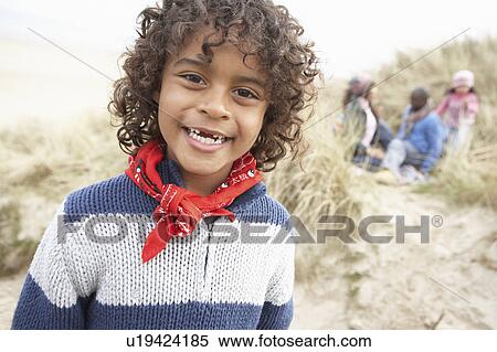 Stock Photography - Family Having Fun On Winter Beach. Fotosearch