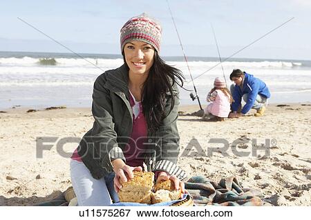 Family Having Picnic On Winter Beach View Large Photo Image Stock Photo - Family Having Picnic On Winter Beach. Fotosearch