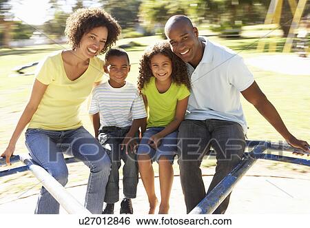 Family In Park Riding On Roundabout View Large Photo Image Stock Photograph - Family In Park Riding On Roundabout. Fotosearch