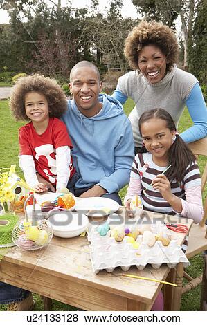 Family Painting Easter Eggs In Gardens View Large Photo Image Stock Photo - Family Painting Easter Eggs In Gardens. Fotosearch