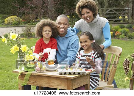 Family Painting Easter Eggs In Gardens View Large Photo Image Stock Photograph - Family Painting Easter Eggs In Gardens. Fotosearch