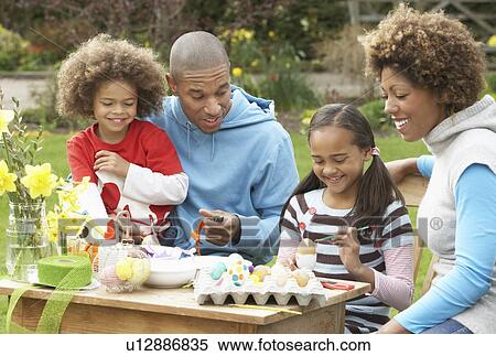 Family Painting Easter Eggs In Gardens View Large Photo Image Stock Photography - Family Painting Easter Eggs In Gardens. Fotosearch