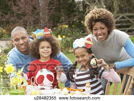 Family Painting Easter Eggs In Gardens View Large Photo Image Stock Photography - Family Painting Easter Eggs In Gardens. Fotosearch