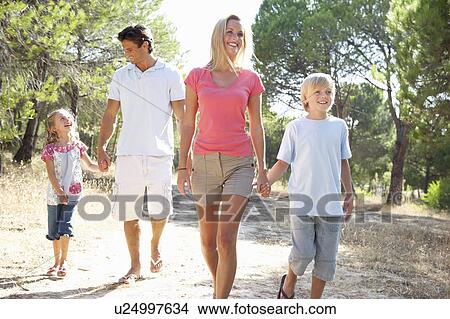 Picture - Family, parents and children, walking, walk together in park. Fotosearch