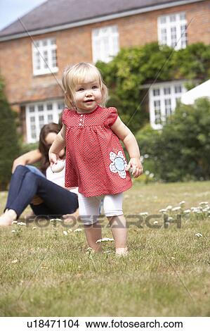 Family Playing Together In Garden At Home View Large Photo Image Picture - Family Playing Together In Garden At Home. Fotosearch