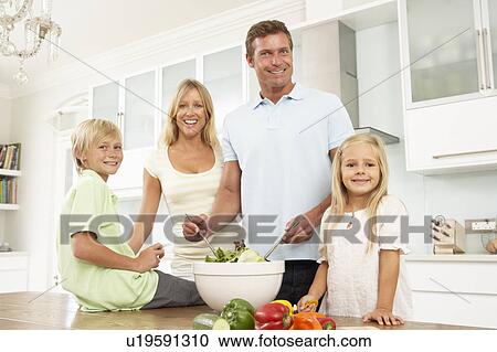 Family Preparing Salad In Modern Kitchen View Large Photo Image Stock Image - Family Preparing Salad In Modern Kitchen. Fotosearch