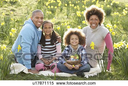 Family Relaxing In Field Of Spring Daffodils View Large Photo Image Stock Photography - Family Relaxing In Field Of Spring Daffodils. Fotosearch