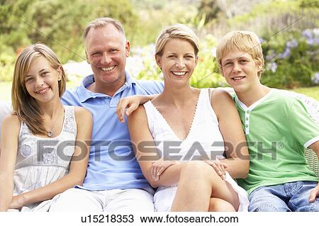Family Relaxing In Garden View Large Photo Image Stock Image - Family Relaxing In Garden. Fotosearch