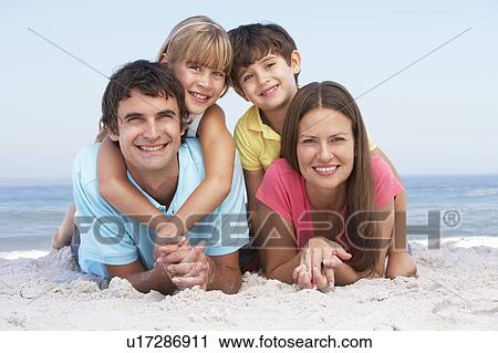 Family Relaxing On Beach Holiday View Large Photo Image Stock Image - Family Relaxing On Beach Holiday. Fotosearch