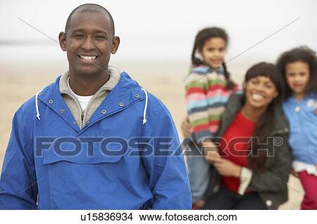 Family Relaxing On Winter Beach Break View Large Photo Image Picture - Family Relaxing On Winter Beach Break . Fotosearch
