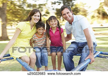 Family Riding On Roundabout In Park View Large Photo Image Stock Image - Family Riding On Roundabout In Park. Fotosearch