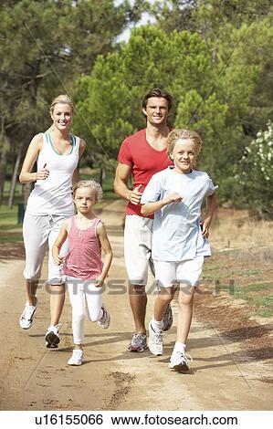 Stock Photograph - Family running on path in park. Fotosearch
