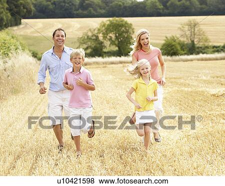 Family Running Together Through Summer Harvested Field View Large Photo Image Stock Photo - Family Running Together Through Summer Harvested Field. Fotosearch