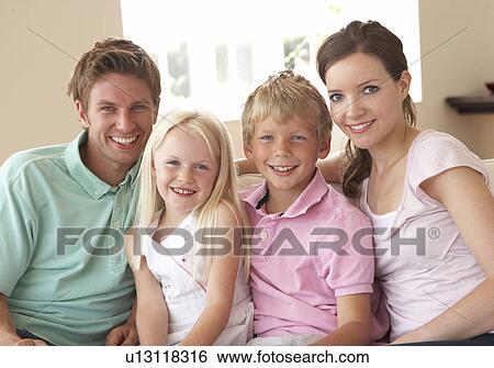 Family Sitting On Sofa At Home Together View Large Photo Image Stock Photograph - Family Sitting On Sofa At Home Together. Fotosearch