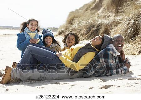 Family Sitting On Winter Beach View Large Photo Image Picture - Family Sitting On Winter Beach. Fotosearch
