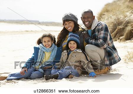Family Sitting On Winter Beach View Large Photo Image Stock Image - Family Sitting On Winter Beach. Fotosearch