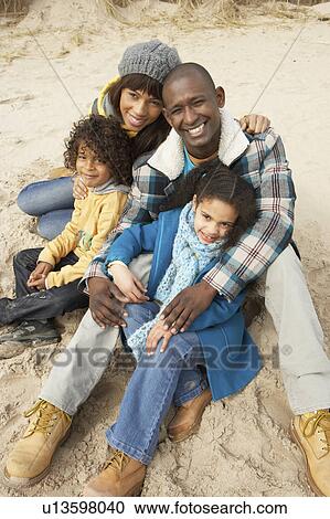 Family Sitting On Winter Beach View Large Photo Image Stock Image - Family Sitting On Winter Beach. Fotosearch