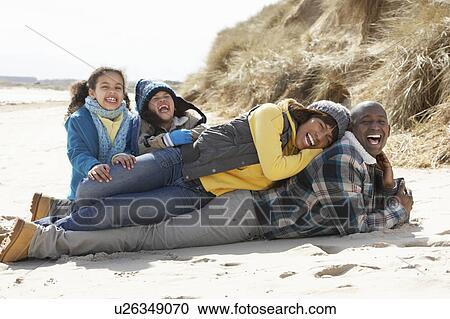Family Sitting On Winter Beach View Large Photo Image Stock Image - Family Sitting On Winter Beach. Fotosearch