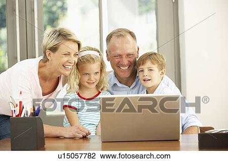 Family Using Laptop At Home View Large Photo Image Stock Image - Family Using Laptop At Home. Fotosearch