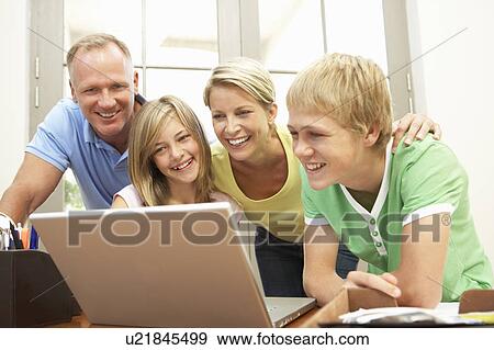 Family Using Laptop At Home View Large Photo Image Stock Photo - Family Using Laptop At Home. Fotosearch