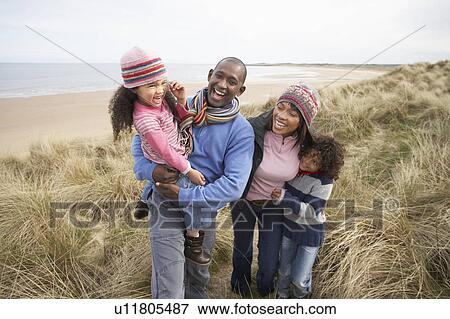 Family Walking Along Dunes On Winter Beach View Large Photo Image Stock Photo - Family Walking Along Dunes On Winter Beach. Fotosearch
