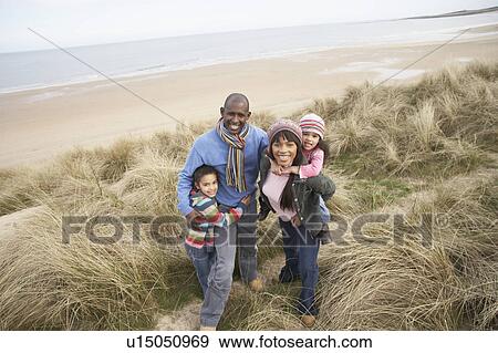 Family Walking Along Dunes On Winter Beach View Large Photo Image Stock Photo - Family Walking Along Dunes On Winter Beach. Fotosearch