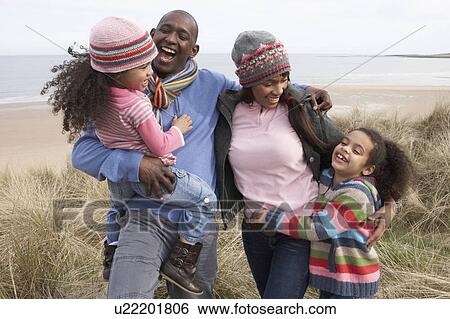 Family Walking Along Dunes On Winter Beach View Large Photo Image Stock Photograph - Family Walking Along Dunes On Winter Beach. Fotosearch