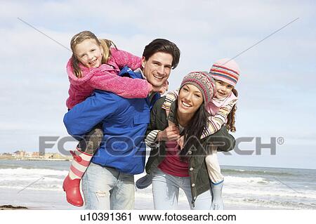 Family Walking Along Winter Beach View Large Photo Image Stock Image - Family Walking Along Winter Beach. Fotosearch