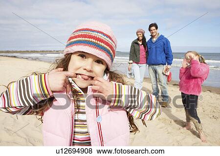 Family Walking Along Winter Beach View Large Photo Image Stock Photo - Family Walking Along Winter Beach. Fotosearch