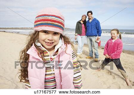 Family Walking Along Winter Beach View Large Photo Image Stock Photo - Family Walking Along Winter Beach. Fotosearch