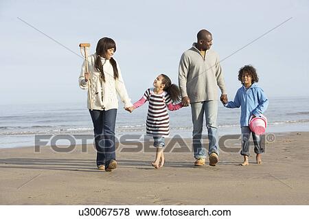 Family Walking By Sea On Winter Beach View Large Photo Image Stock Photo - Family Walking By Sea On Winter Beach. Fotosearch