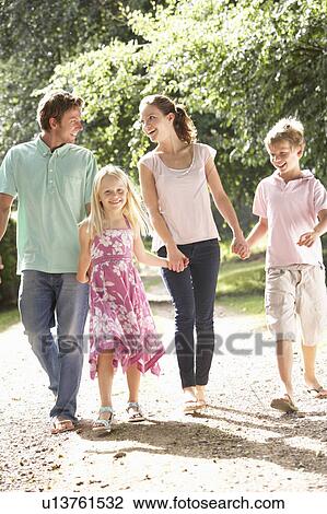 Family Walking In Countryside Together View Large Photo Image Stock Image - Family Walking In Countryside Together. Fotosearch